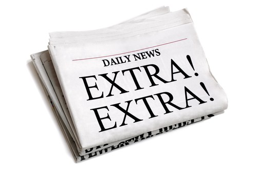 Daily newspaper showing Newspaper headline Extra Extra isolated on white background