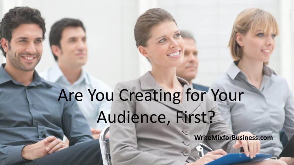 Visual two Audience First Presentations for Write Mix for Business by Sue-Ann Bubacz showing a smiling and attentive audience looking forward and up ...presumably at a powerful presentation