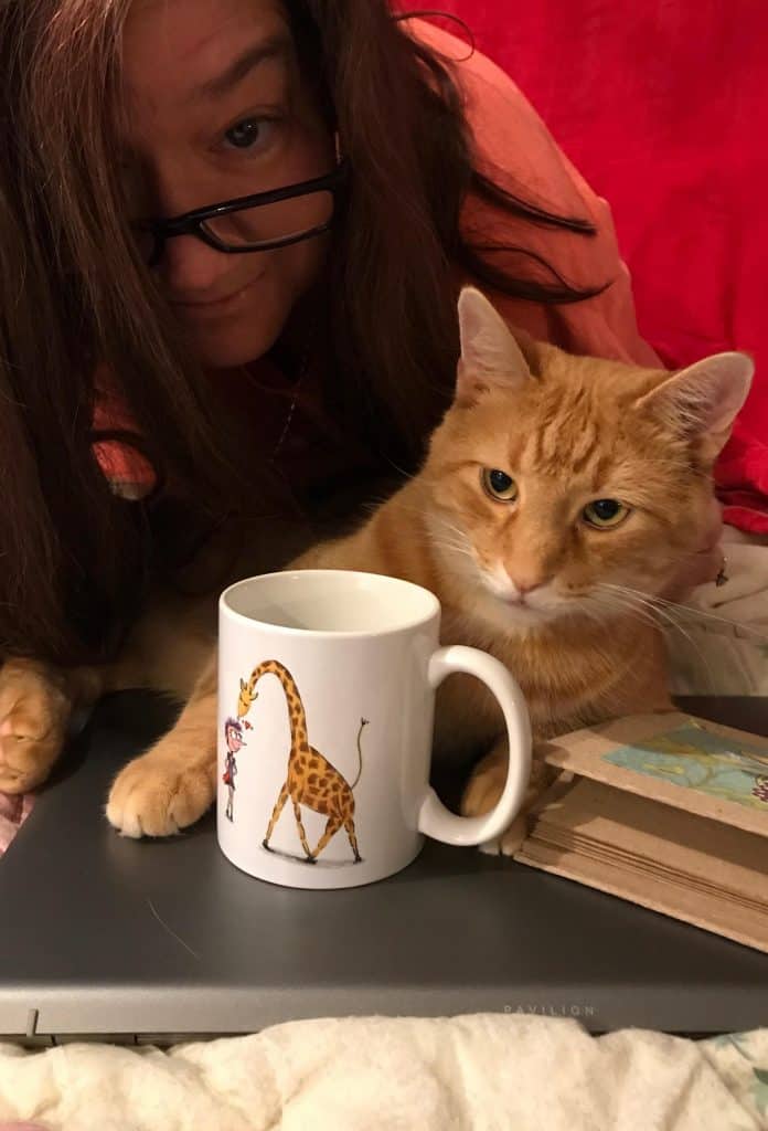 Visual 3 for post by Sue-Ann Bubacz for Write Mix for Business showing pic of me with a HennekeD created "Henrietta Magical Mug" called Cup of Kindness and showing my and my kitty Tino hanging with laptop and kindness mug!