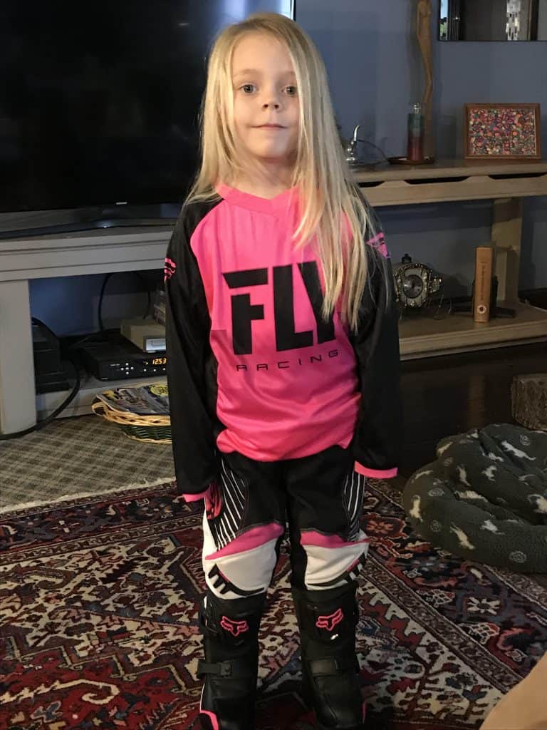Ryder Wetzel at 4 years old thinking about riding her new motorcycle but at least she has the gear on!